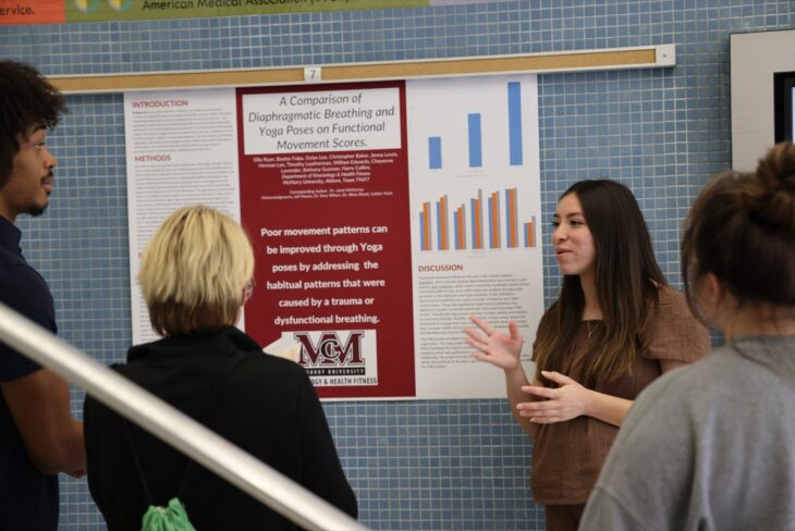 Student presents presentation at symposium